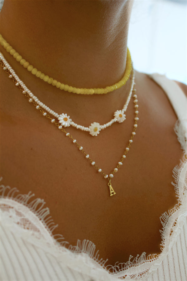 DAISIES AND PEARL NECKLACE